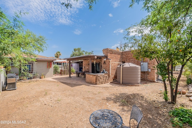 rear view of house with a patio