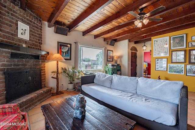 tiled living room with a fireplace, ceiling fan, wood ceiling, and beam ceiling