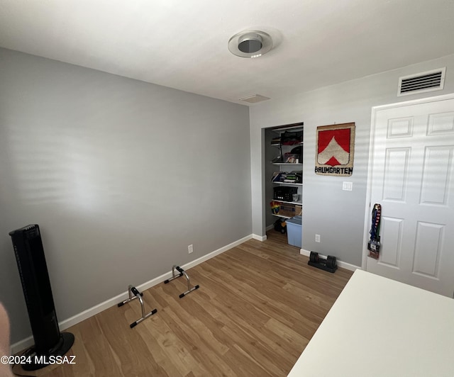 unfurnished bedroom featuring hardwood / wood-style floors