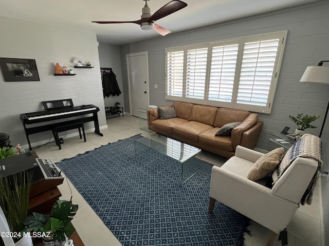 tiled living room featuring ceiling fan and a baseboard radiator