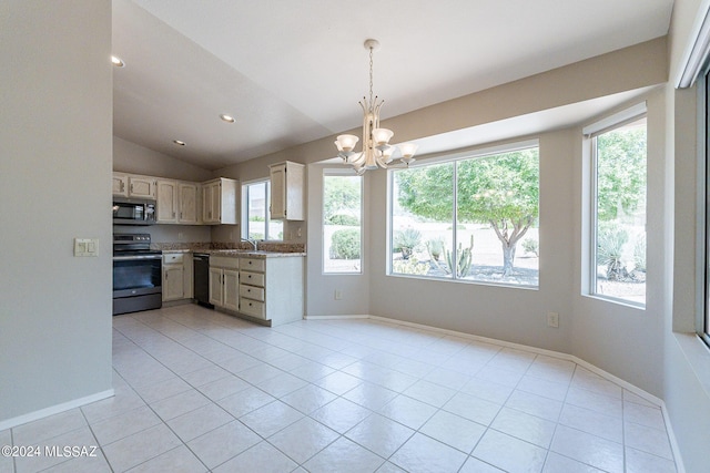 kitchen with vaulted ceiling, hanging light fixtures, light tile patterned floors, stainless steel appliances, and an inviting chandelier