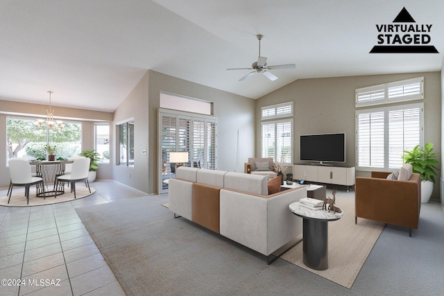 living room with ceiling fan, high vaulted ceiling, and light tile patterned floors