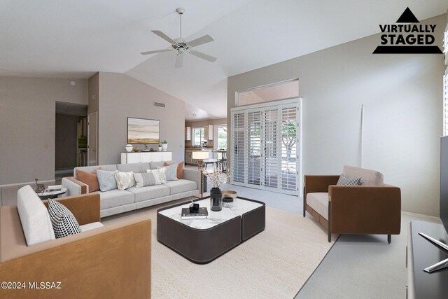 carpeted living room featuring lofted ceiling and ceiling fan