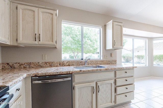 kitchen featuring electric stove, sink, light tile patterned floors, dishwasher, and light stone counters