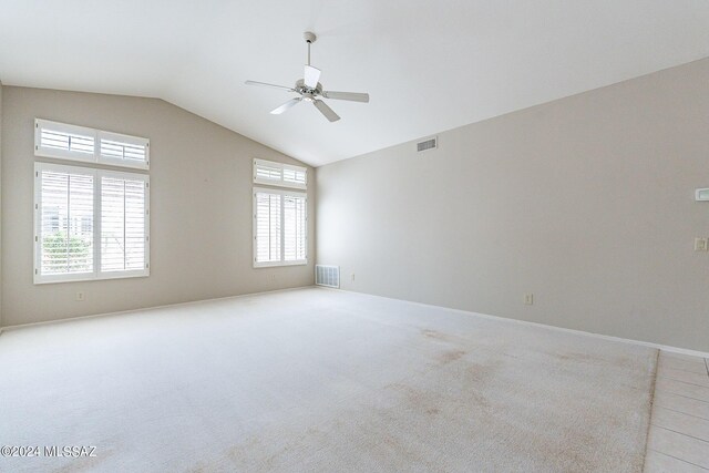 unfurnished room with ceiling fan, high vaulted ceiling, and light colored carpet