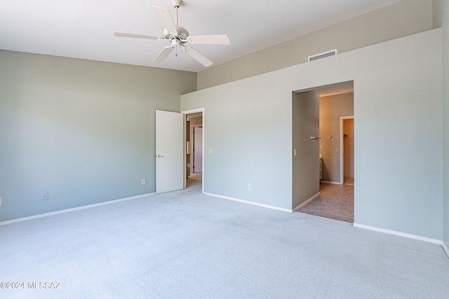 unfurnished bedroom with light carpet and ceiling fan