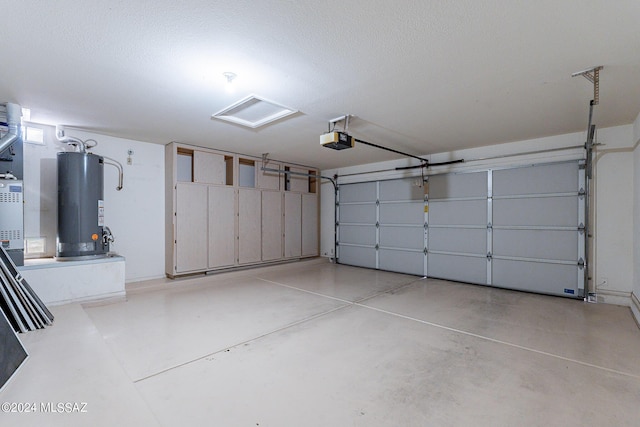 garage featuring a garage door opener and water heater