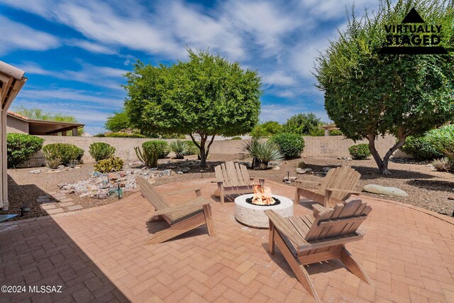 view of patio featuring a fire pit