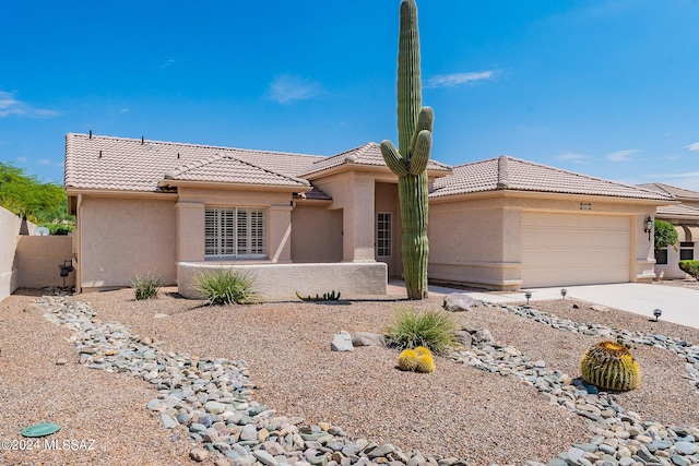 view of front of property with a garage