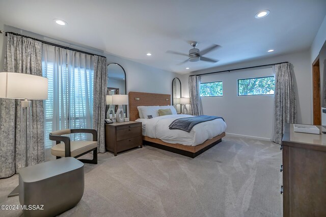 carpeted bedroom with ceiling fan