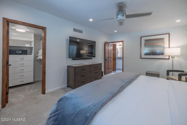 carpeted bedroom with ceiling fan