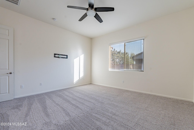 spare room with light carpet and ceiling fan