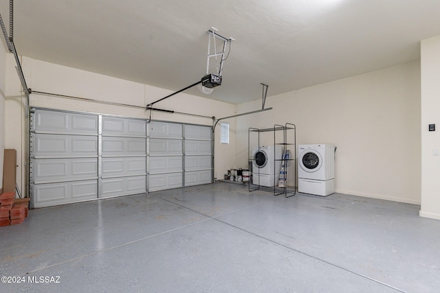 garage featuring a garage door opener and separate washer and dryer