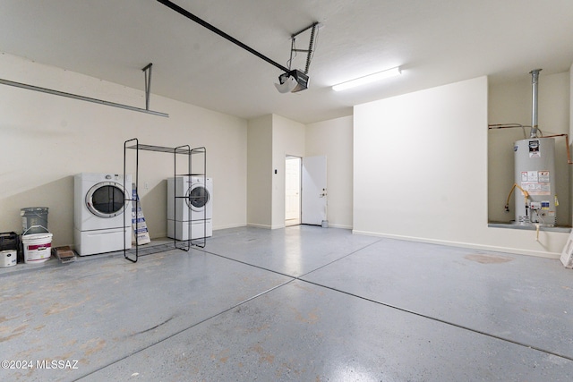 garage featuring washer / dryer, a garage door opener, water heater, and white refrigerator