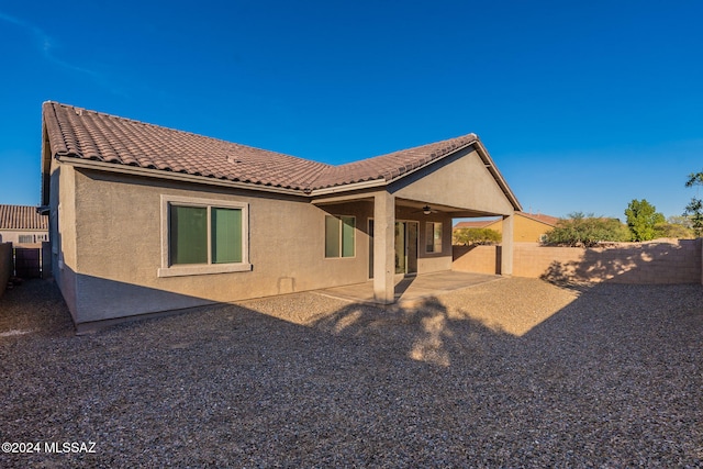 rear view of house featuring a patio