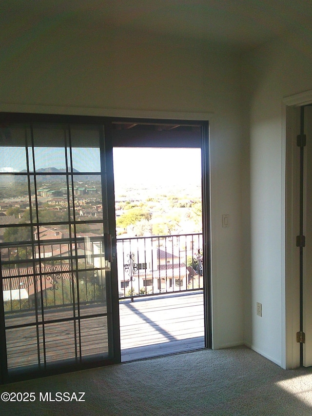 doorway featuring carpet