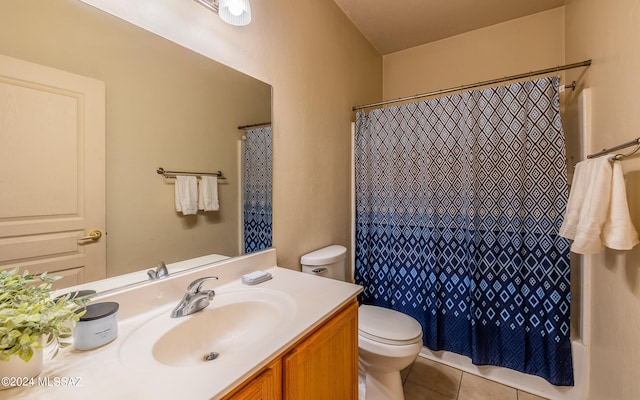 bathroom with vanity, tile patterned flooring, and toilet