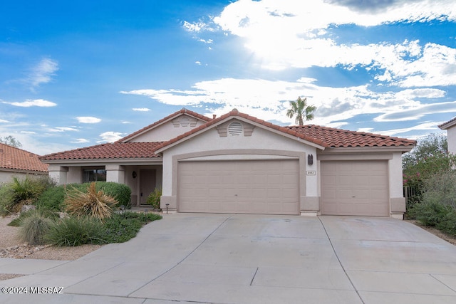 mediterranean / spanish-style home featuring a garage