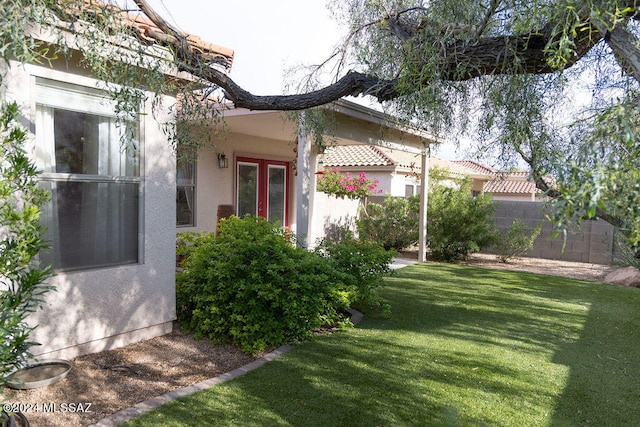 view of yard featuring french doors