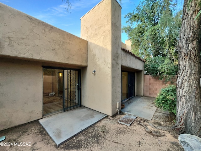 back of property with a patio area