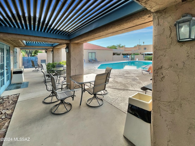 view of patio featuring a community pool