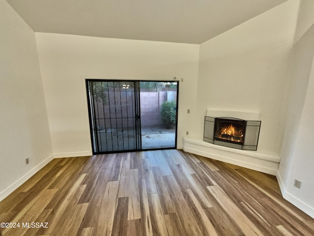 unfurnished living room featuring hardwood / wood-style floors