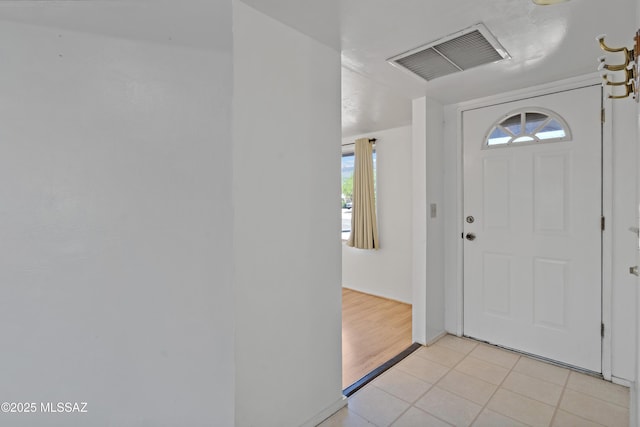 entryway featuring visible vents, plenty of natural light, and light tile patterned flooring