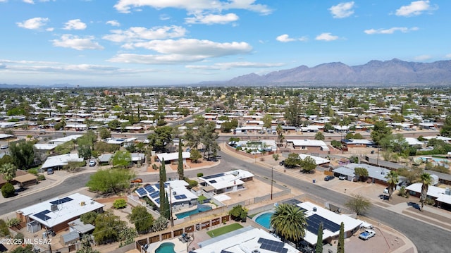 birds eye view of property with a mountain view and a residential view