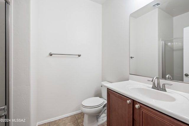 bathroom with tile patterned floors, vanity, and toilet