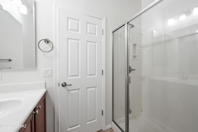 bathroom with vanity and walk in shower