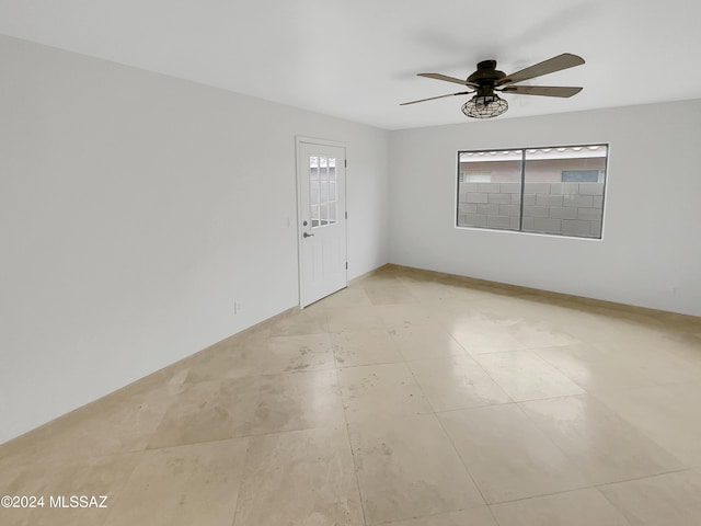 spare room with plenty of natural light and ceiling fan