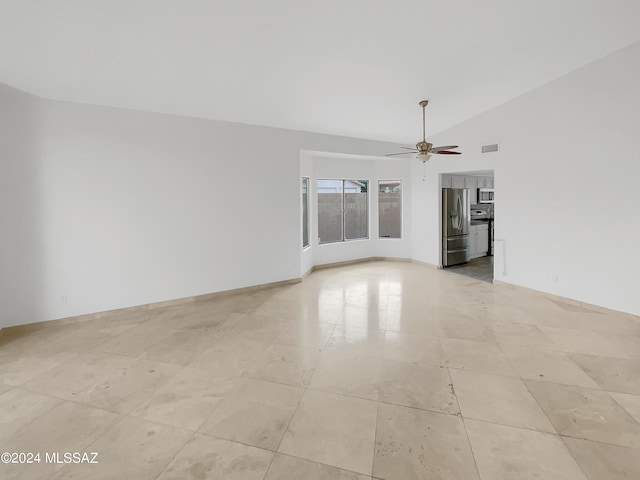 unfurnished room featuring vaulted ceiling and ceiling fan