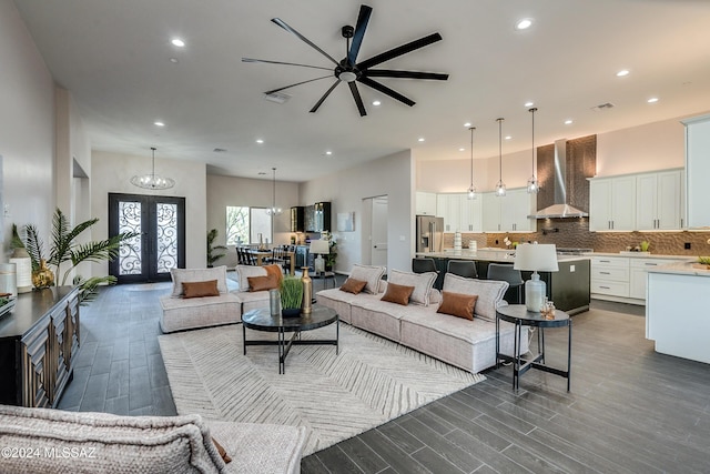 living room with french doors and a high ceiling