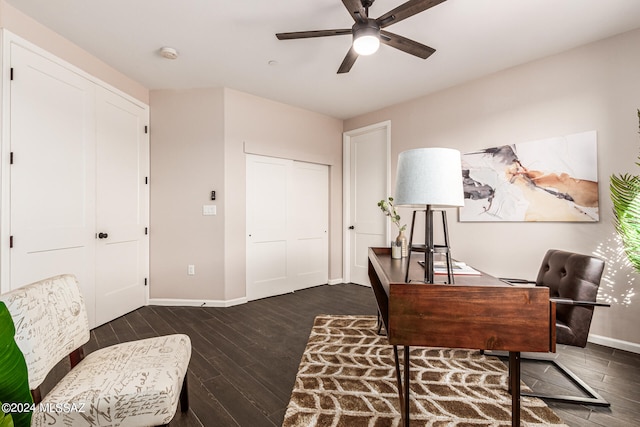 office with dark wood-type flooring and ceiling fan