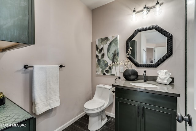 bathroom with vanity and toilet