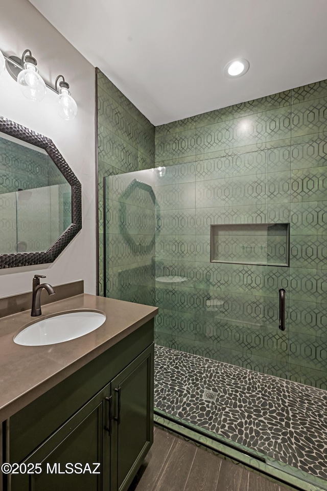 2102 N Corte El Rancho Merlita, Tucson, AZ 85715 - bathroom featuring vanity, wood finished floors, and a stall shower