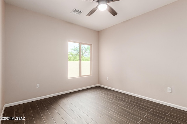 unfurnished room with dark wood-type flooring and ceiling fan