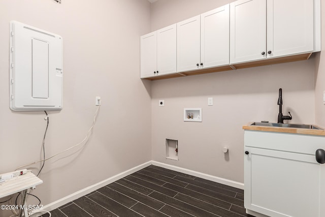 laundry area with sink, gas dryer hookup, cabinets, electric dryer hookup, and washer hookup