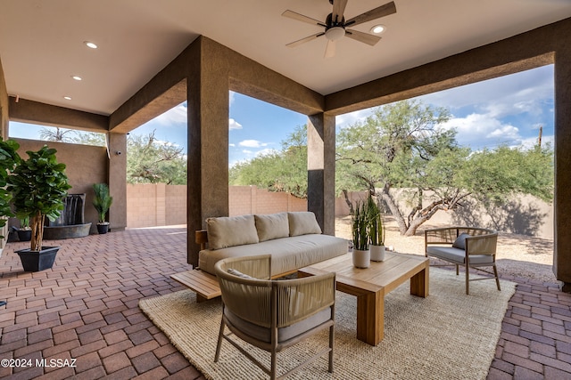 view of patio featuring an outdoor living space and ceiling fan