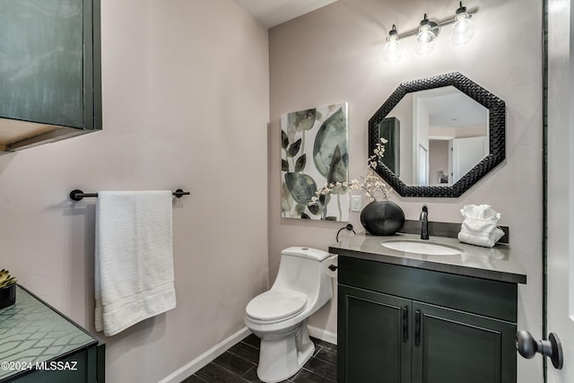 2102 N Corte El Rancho Merlita, Tucson, AZ 85715 - half bath with vanity, toilet, and baseboards