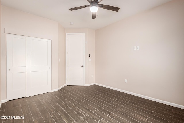 2102 N Corte El Rancho Merlita, Tucson, AZ 85715 - unfurnished bedroom featuring dark wood finished floors, baseboards, a closet, and ceiling fan