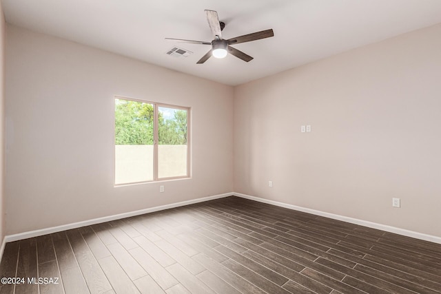 2102 N Corte El Rancho Merlita, Tucson, AZ 85715 - unfurnished room featuring baseboards, a ceiling fan, and dark wood-style floors