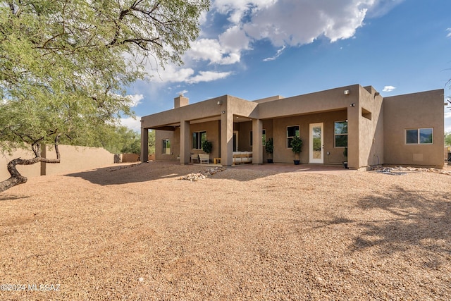 2102 N Corte El Rancho Merlita, Tucson, AZ 85715 - back of house with stucco siding and a chimney