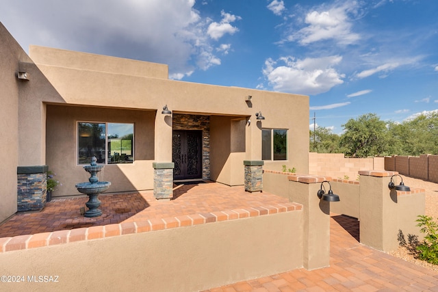 adobe home with a patio