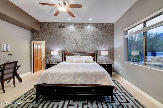 tiled bedroom with ceiling fan