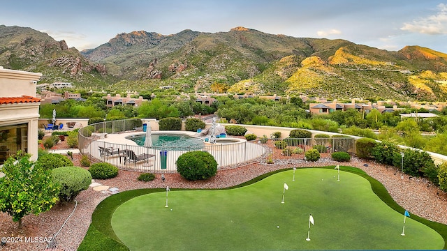 view of pool with a mountain view and a patio