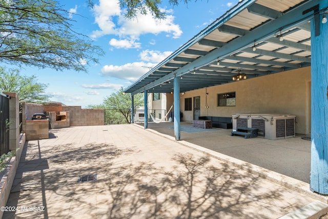 view of patio featuring exterior kitchen and a fenced backyard