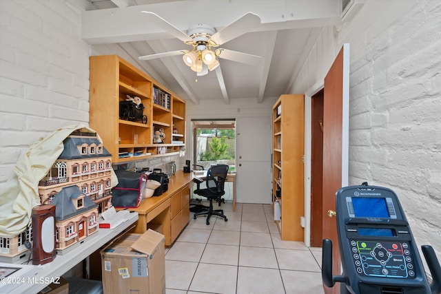 office area with vaulted ceiling with beams, light tile patterned flooring, and ceiling fan