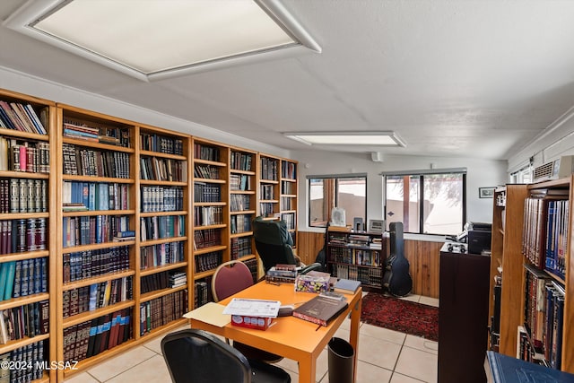 office featuring lofted ceiling and light tile patterned floors