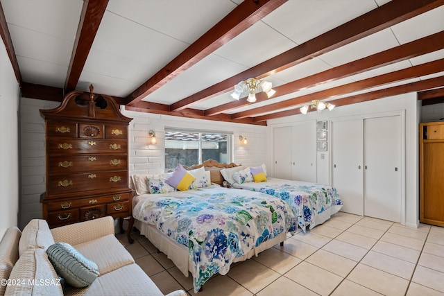 tiled bedroom featuring wood walls, beamed ceiling, and a notable chandelier